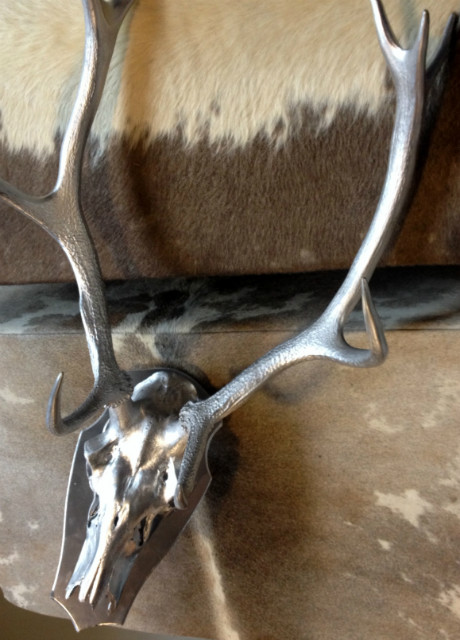 Red deer antlers covered with silver gray paint.