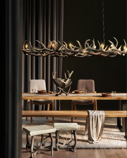 10 - the antler lamp 250 cm above the table, cooler on the table, stools in front of the picture to the left